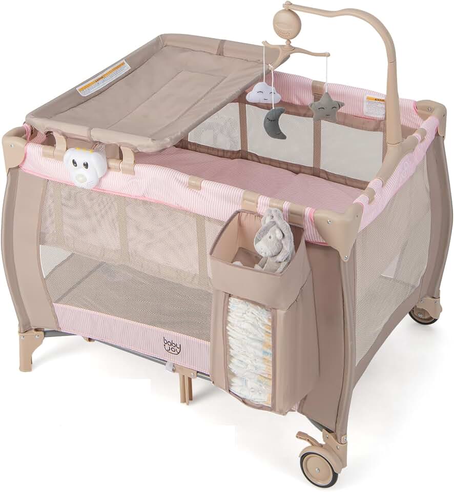 Costzon 3 in 1 Pink Pack and Play with Bassinet, Portable Baby Playard with Changing Table, Music Box, Hangings, Wheels/Brake, Basket, Foldable Infant Pink Bassinet Crib for Baby Girl Toddlers OEKO-TEX STANDARD 100